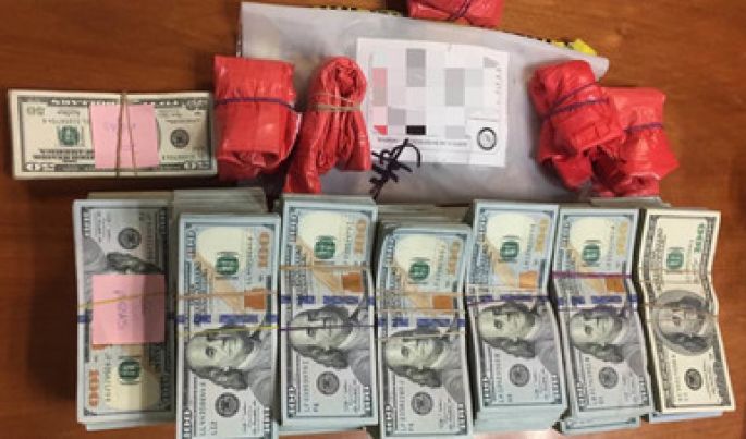 Realiza la PGR un cateo y asegura casi 700 mil dólares, vehículos y armas de fuego en Tamaulipas